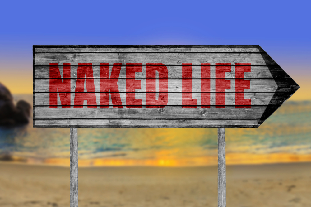 Red,Naked,Life,Wooden,Sign,With,A,Beach,On,Background